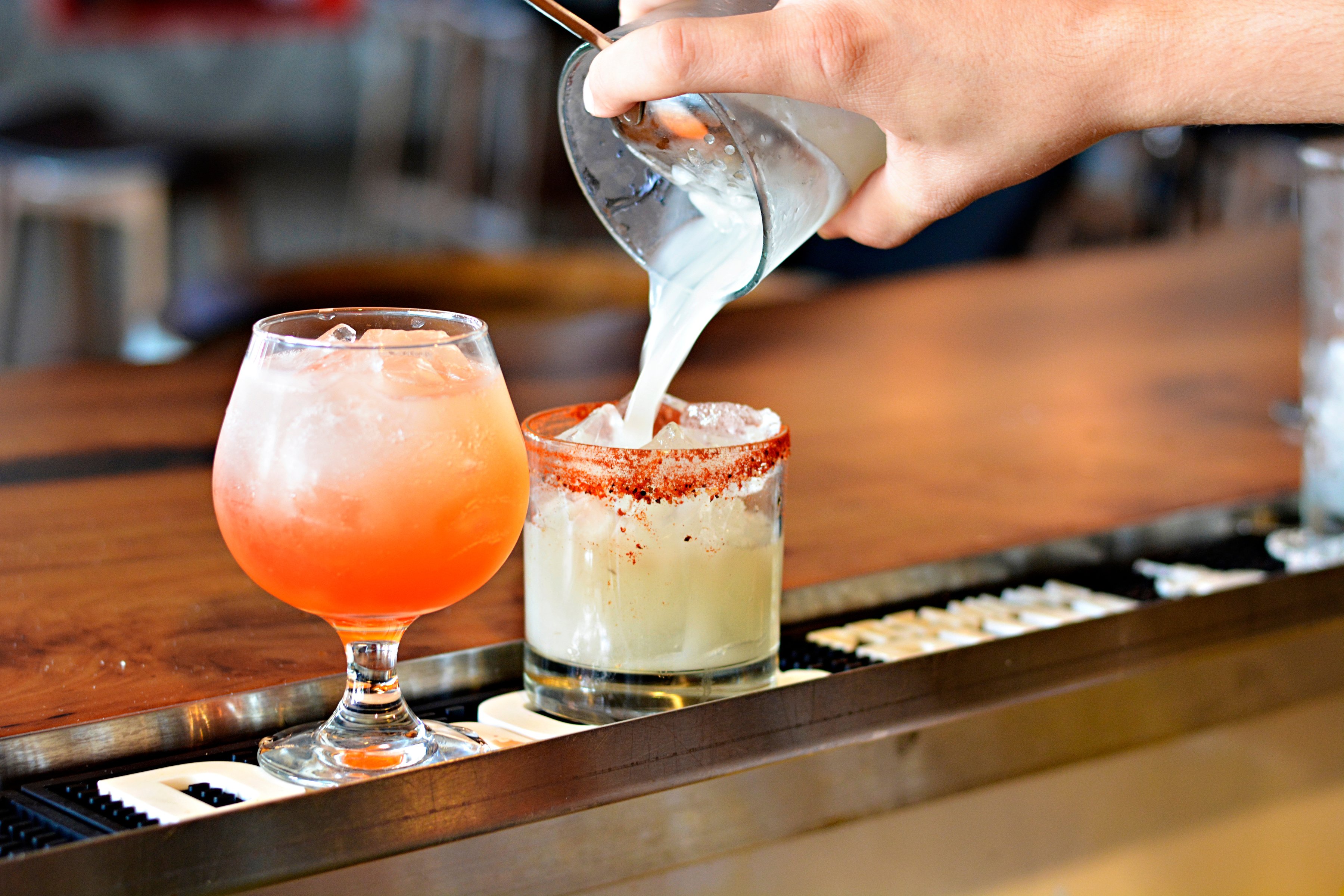 Bartender pouring drinks